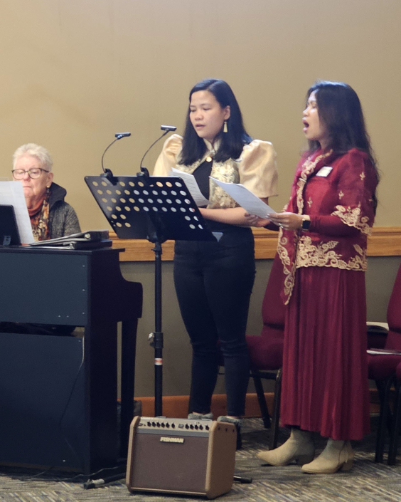 20260131_120922_Filipino Music_LR, Mary Krupka, Nathalie Navarra, Vhine Hull_NPM Winter Meeting_St Isaac Jogues,RC,SD_phtg MCN_CROP1;4x5_Lv.b00,w255,m0.92